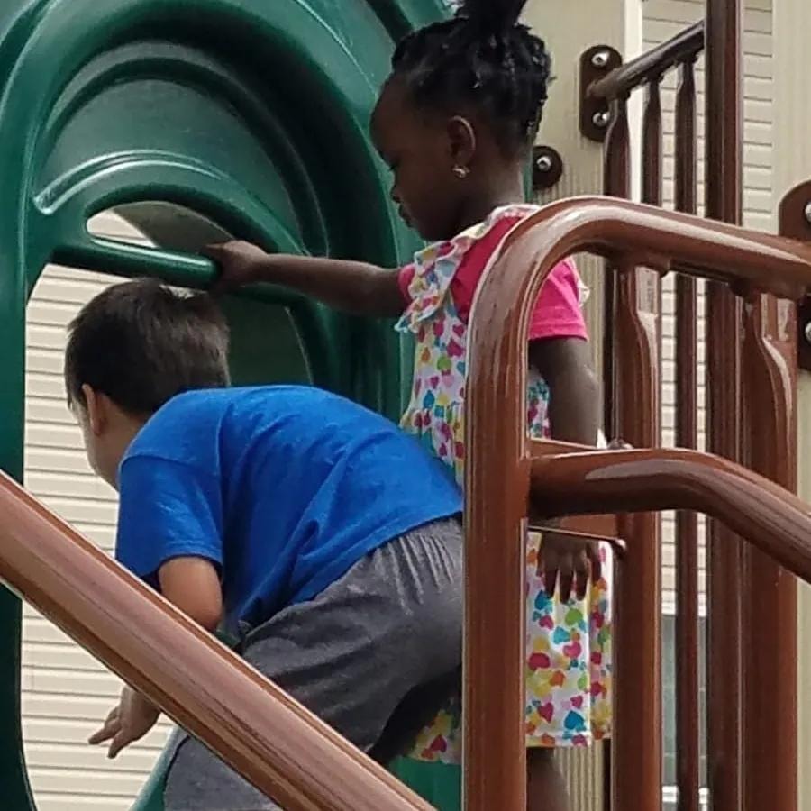 Children playing together on playground equipment